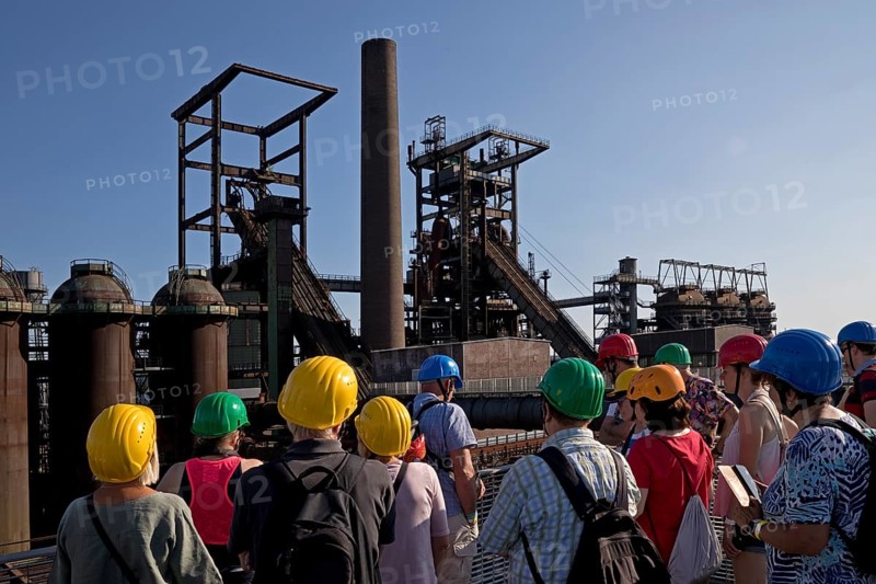 Group on the skywalk with a view of the blast furnaces, former Phoenix West industrial plant, Dortmund, Ruhr region, North Rhine-Westphalia, Germany, Europe