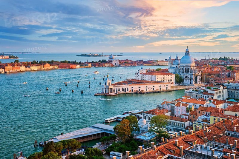 Aerial view of Venice lagoon and Santa Maria della Salute church on sunset. Venice, Italy, Europe