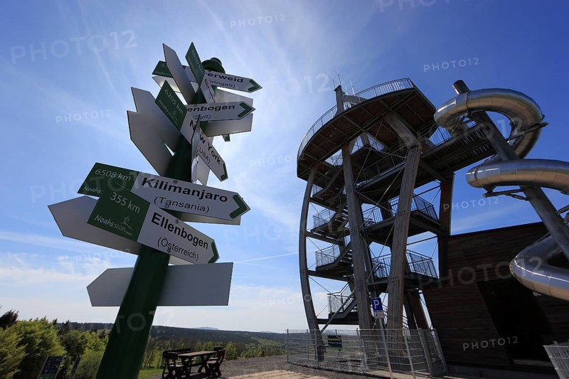 World signpost, Noah's Sails lookout tower on Ellenbogen, 813 m. high mountain in the Rhön in the Schmalkalden-Meiningen district, Thuringia, Germany, Europe