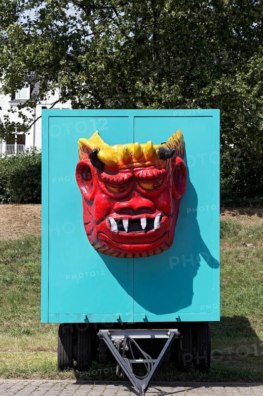 Devil's grimace, face of a monster with fangs and horns on a fairground float, Rheinkirmes, Düsseldorf, North Rhine-Westphalia, Germany, Europe