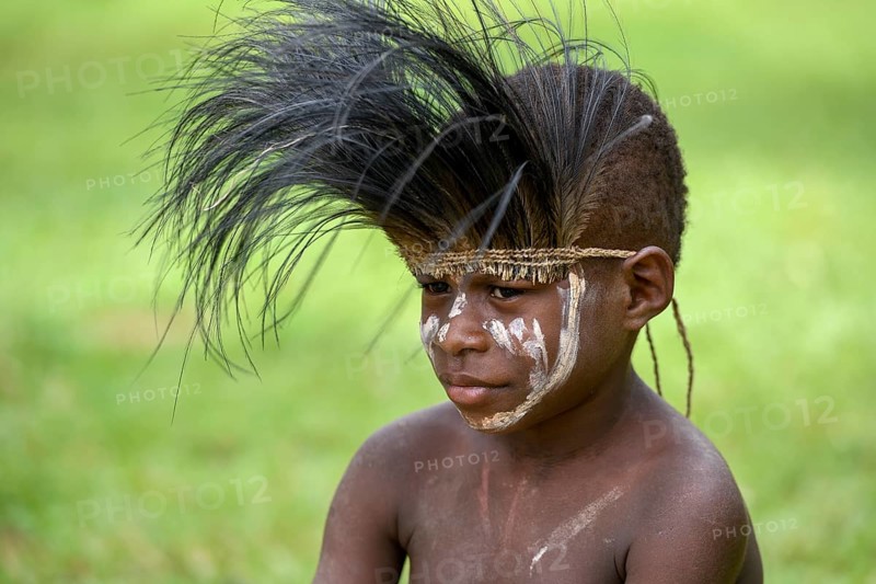 Native boy with cassowary feather headdress, village of Mutin, Lake Murray, Western Province, Papua New Guinea, Oceania