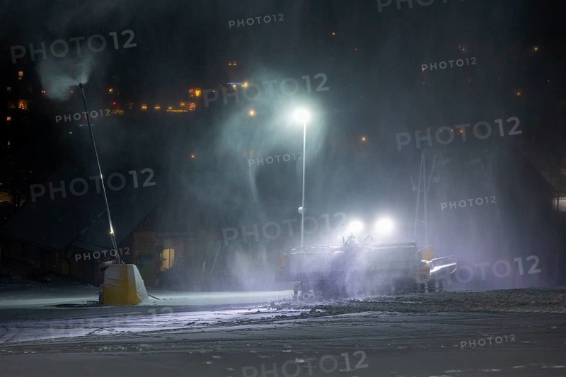 In anticipation of easing of the corona-induced logdown, the ski slope in Altenberg, Saxony, in the Ore Mountains, is artificially snowed with snow cannons. A snow groomer in action