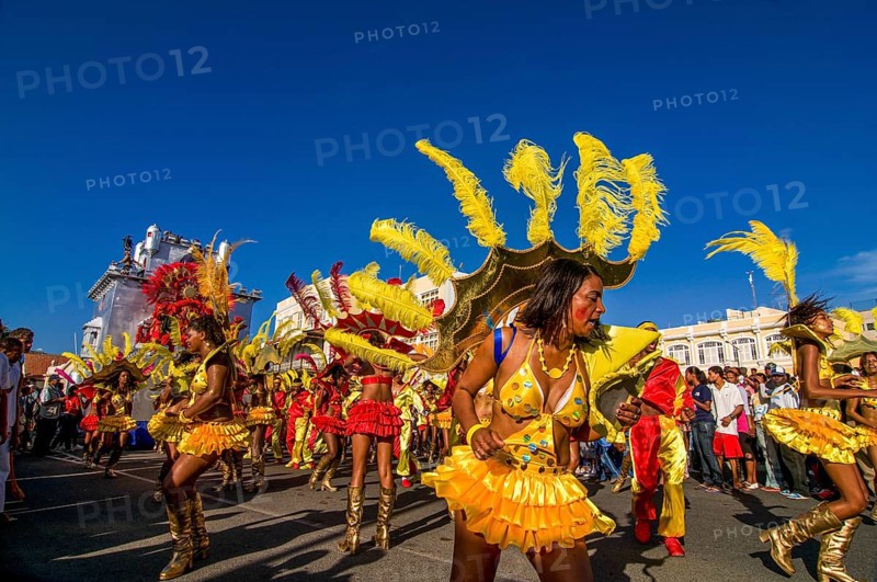 Colourful costumed, pretty women are dancing. Carnival. Mindelo. Cabo Verde. Africa