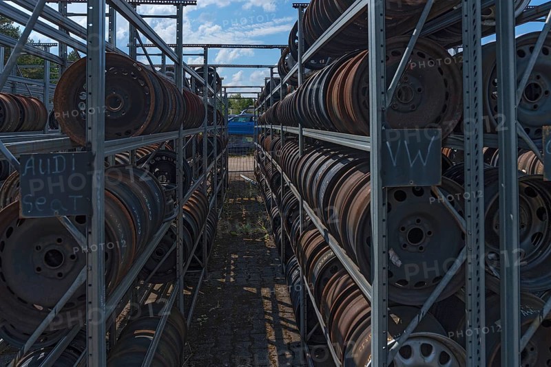 Shelf storage with sorted car rims at a scrap yard, Bavaria, Germany, Europe