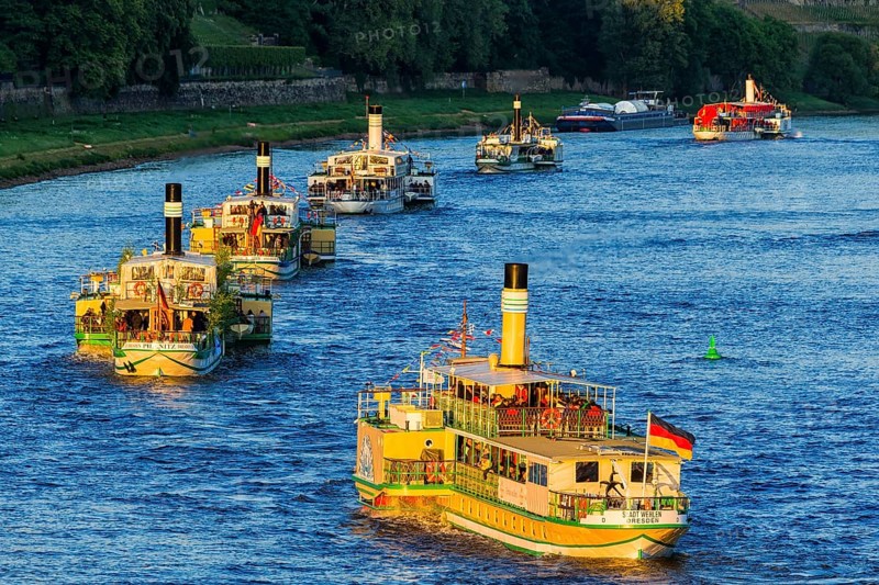 DEU Saxony Dresden Since 1995, at the 25th International Dixieland Festival, steamers and saloon ships festively flagged over all tops left the mooring bridges on the Terrassenufer. Since then the RIVERBOAT-SHUFFLE with the world's largest fleet of paddle steamers has been one of the highlights of the festival