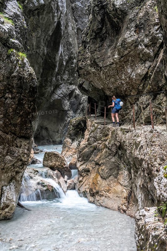 Hiker in a gorge, Hammersbach flows through Höllentalklamm, near Garmisch-Partenkirchen, Werdenfelser Land, Upper Bavaria, Bavaria, Germany, Europe