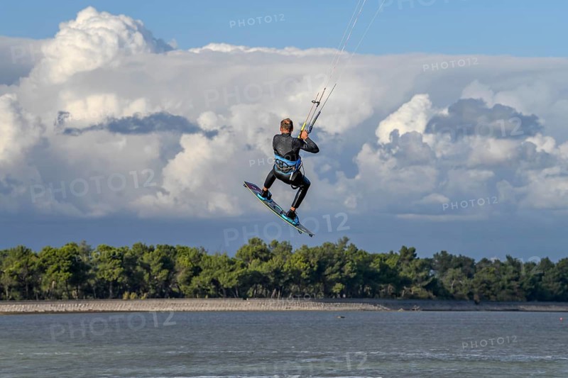 Kite surfing in the air, Grado Pineta beach, Lagoon di Grado, Friuli Venezia Giulia region, Italy, Europe