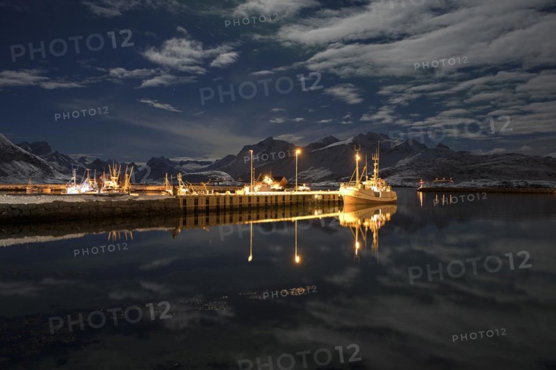 Ramberg harbour at midnight under a full moon in winter