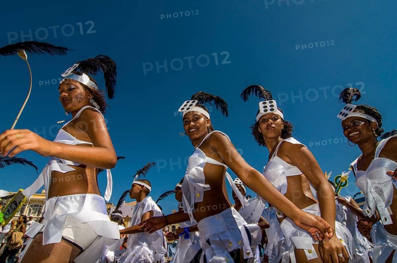 Colourful costumed, pretty women are dancing. Carnival. Mindelo. Cabo Verde. Africa