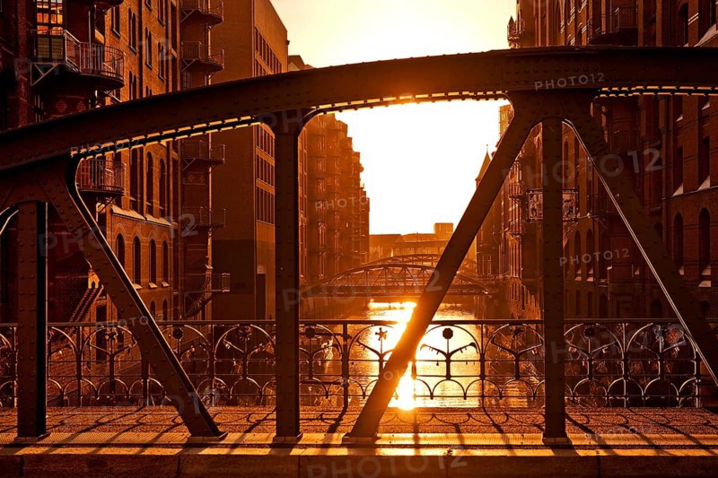 View from the Kannengießerort Bridge backlit into the Wandrahmsfleet, Speicherstadt, Hamburg, Germany, Europe