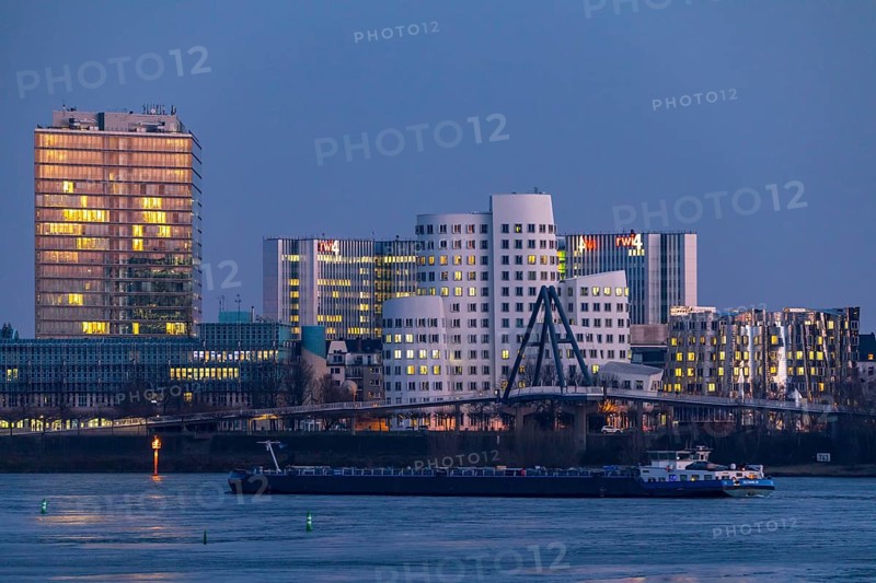 Düsseldorf, the Gehry buildings, Neuer Zollhof, in the media harbour, on the left the Stadttor building, behind the RWI4 building complex, Rhine, cargo ship