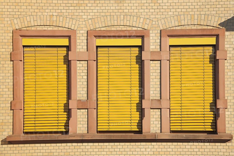 Three yellow closed windows at the Robert Koch School, house wall, facade, yellow, monochrome, closed, shutters, blinds, Höchst, Main, Frankfurt, Hesse, Germany, Europe