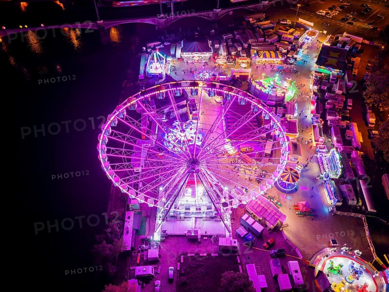 A 55m high illuminated Ferris wheel is the landmark of the fair at the Volksfest grounds on Pieschner Allee in Dresden