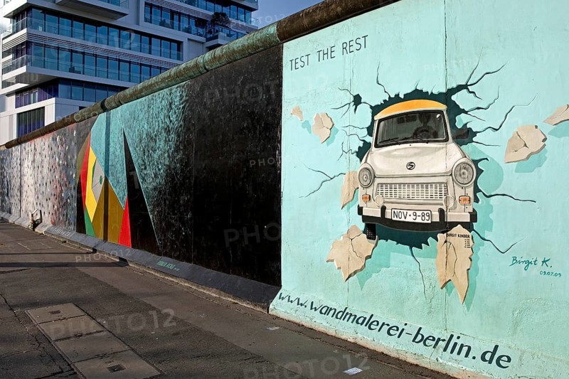 Mural on remnant of the Berlin Wall with the cardiac stress test (Test The Rest), Trabi durchbricht Mauer, artist Birgit Kinder, East Side Gallery, Berlin, Germany, Europe