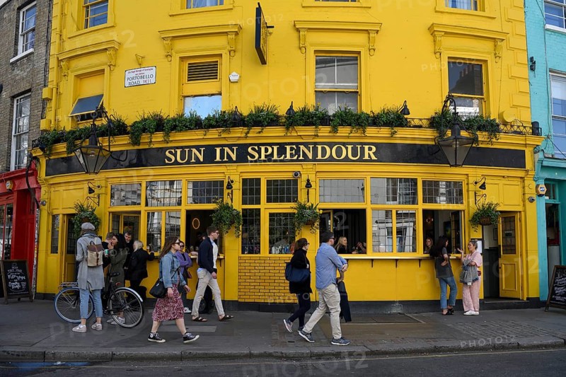 Guests and passers-by outside the Sun pub in Splendour on Portobello Road, London, England, United Kingdom, Europe