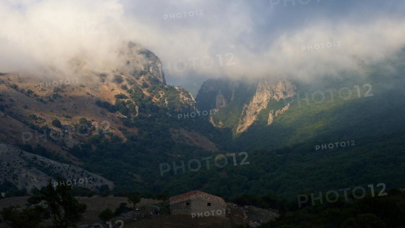 Fog, mountains, valley, green meadows, hut, light and shade, Madonie National Park, spring, Sicily, Italy, Europe