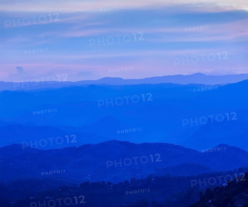 Sunset in mountains in Munnar. Kerala, South India