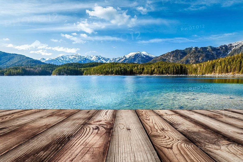Wooden planks European nature background with lake in Alps, Germany, Europe