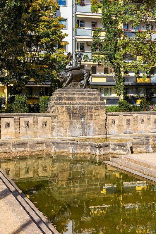 The Europe Fountain with the bronze figure group Europe on the Bull, made by the Dresden sculptor Georg Wrba, is located in the Dresden-Blasewitz district on Königsheimplatz