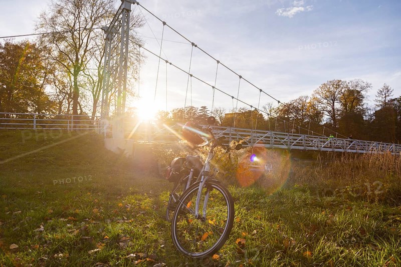Symbolic image Resting on an e-bike tour in the Leipzig region in Grimma at the Mulde bridge