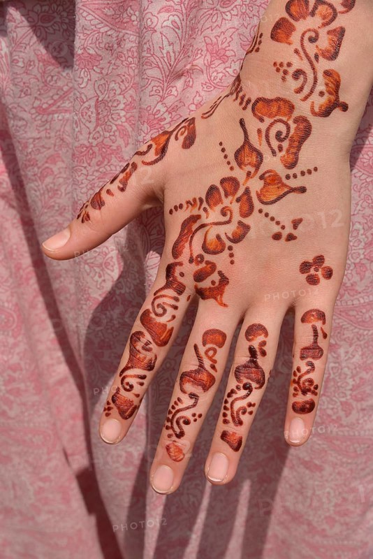 Henna tattoos or mehndi tattoos on a woman's hand, Marrakesh, Marrakesh-Tensift-El Haouz region, Morocco, Africa