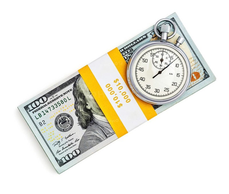 Time is money loan concept background, stopwatch and stack of new 100 US dollars 2013 edition banknotes bills bundles isolated on white