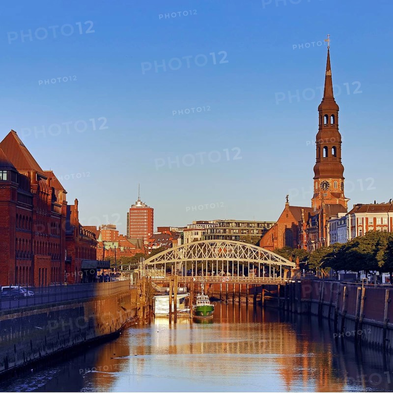 Customs canal with the ship of the customs museum of the Kornhausbrücke and the main church St. Katharinen in the early morning, Hamburg, Germany, Europe