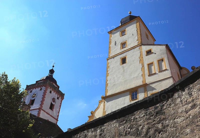 Part of the Seinsheim castle and the tower of the church of St. Nikolai, Marktbreit town, Litzingen district, Lower Franconia, Bavaria, Germany, Europe