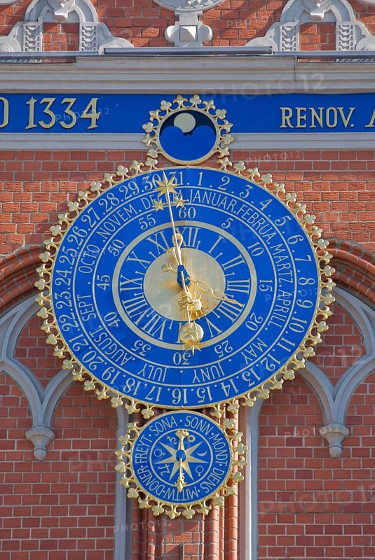 The astronomical clock with the signs of the zodiac, date and time on the façade of the Blackheads' House on the Town Hall Square, Rathausplatz in Riga, Latvia, Europe