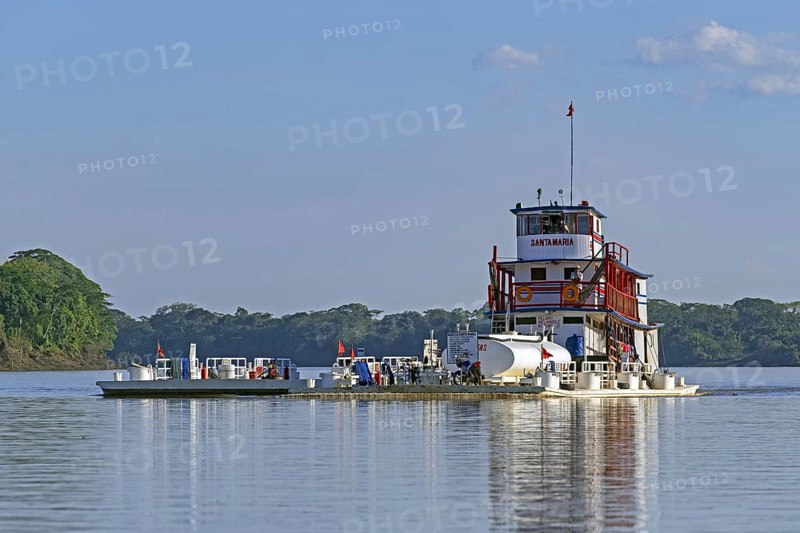 Santa Maria riverboat, river boat pushing flatbed barge with gasoline on the Mamoré river in the Amazon, Beni Department, Bolivia, South America