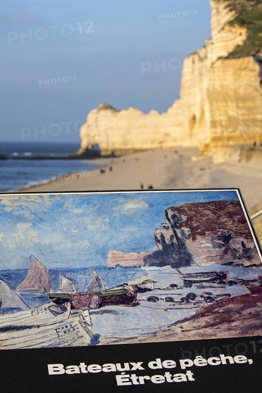 Painting by Claude Monet of fishing boats and the Porte d'Amont, a natural arch in the chalk cliffs at Etretat, Côte d'Albâtre, Upper Normandy, France, Europe