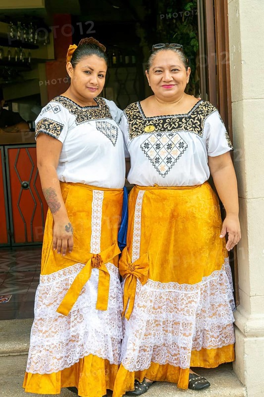 Two waitresses dressed in traditional Mayan clothing at Marganzo restaurant, Campeche city, Campeche State, Mexico, Central America