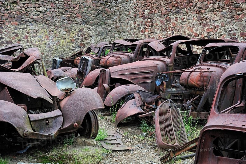 Burnt-out cars in the garage. The burnt village of Oradour-sur-Glane was destroyed on 10 June 1944 when 642 of its inhabitants, including woman and children, were massacred by a German Waffen SS company, Limousin, France, Europe