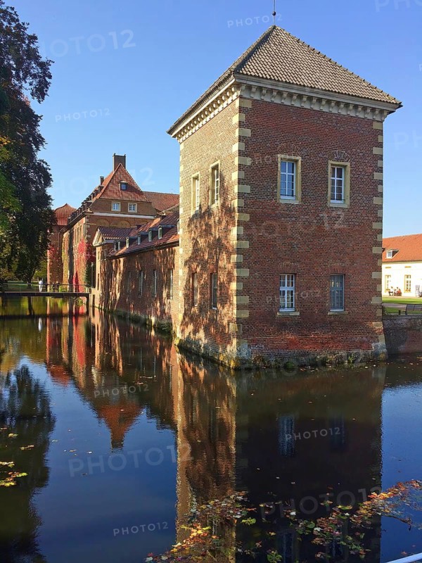 Reflection of tower standing in moat of Westphalian moated castle Schloss Velen, Velen, Münsterland, North Rhine-Westphalia, Germany, Europe