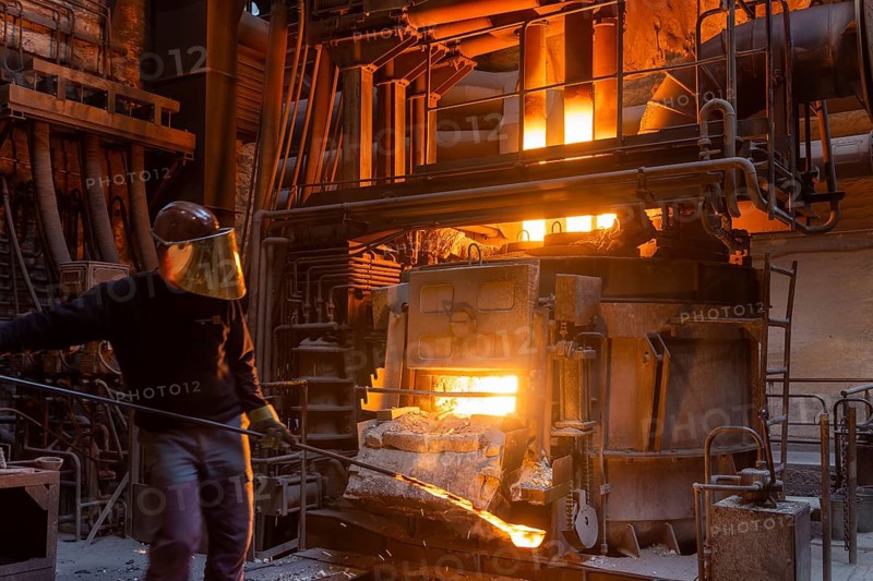 The Schmees foundry in Pirna, Germany, taking a sample of the molten metal, Europe