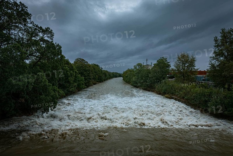 A powerful river with a strong current under a cloudy sky, surrounded by green trees, Schwarza, Neunkirchen, Lower Austria, Austria, Europe