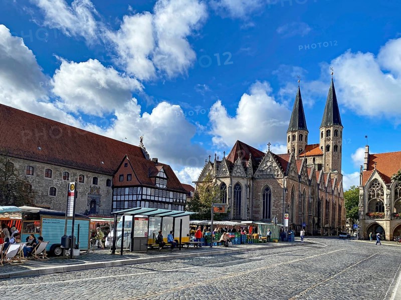 Historic market square scene with Gothic buildings and people under a blue sky with clouds, Market, Old Town Market, Martini Church, Braunschweig, Lower Saxony, Germany, Europe