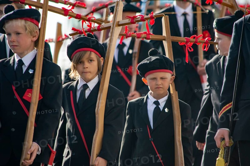 Bergen, Norway, May 2015: kids and teenagers during Christian religious cross procession in Bergen, Norway, Europe
