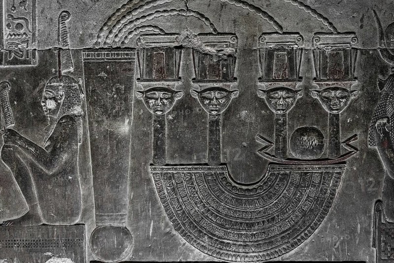 Hieroglyphic carvings on the wall of an ancient egyptian temple