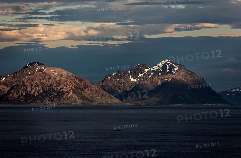Panoramic view of the mountains on the Norwegian Sea coast at sunrise