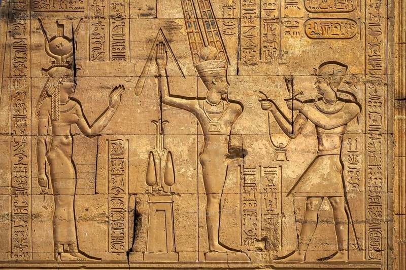 Hieroglyphic carvings on the exterior walls of an ancient egyptian temple