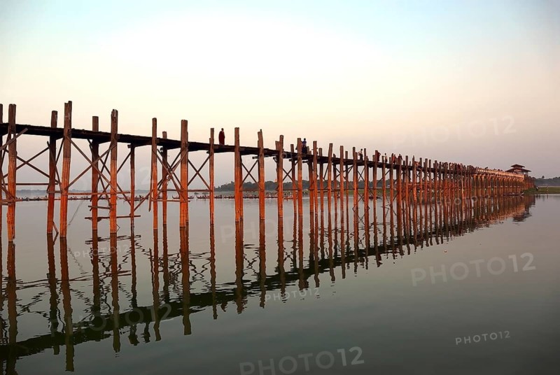 Famous U-Bein teak bridge at sunset on Taungthaman lake in Amarapura, Mandalay division, Myanmar, Asia