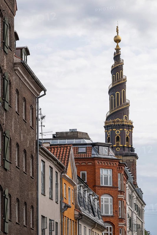 Historic houses, corkscrew-shaped tower of the Evangelical Lutheran Church of the Saviour, in front of Frelsers Kirke, Christianshavn, Copenhagen, Denmark, Europe
