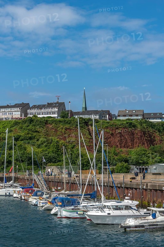 Sailing yachts in the north-east harbour, Buntsandstein cliff, Helgoländer Oberland with church tower of the Nicolaikirche, offshore island Helgoland, North Sea, district Pinneberg, Helgoland, Schleswig-Holstein, Germany, Europe
