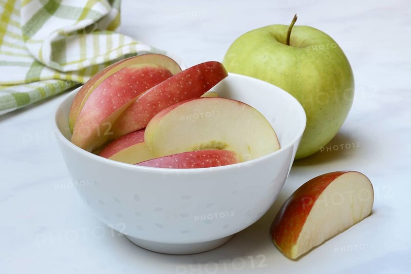 Apple and apple slices in peel, sliced apple