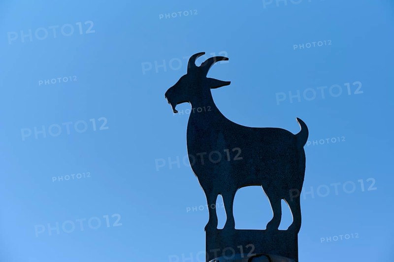 Silhouette of a metallic goat statue in front of a clear blue sky, Fløibanen mountain station, Bergen, Vestland, Norway, Europe