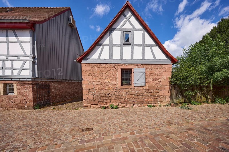 Small half-timbered house on a stone plinth on Hochstraße in Michelstadt, Odenwald, Odenwaldkreis, Hesse, Germany, Europe