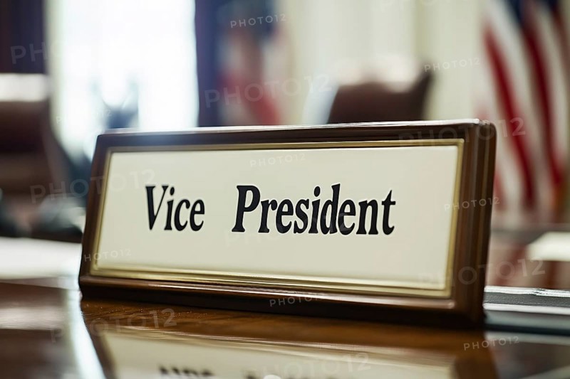 Desk sign with text 'Vice President' on desk in office. Generative Ai, AI generated
