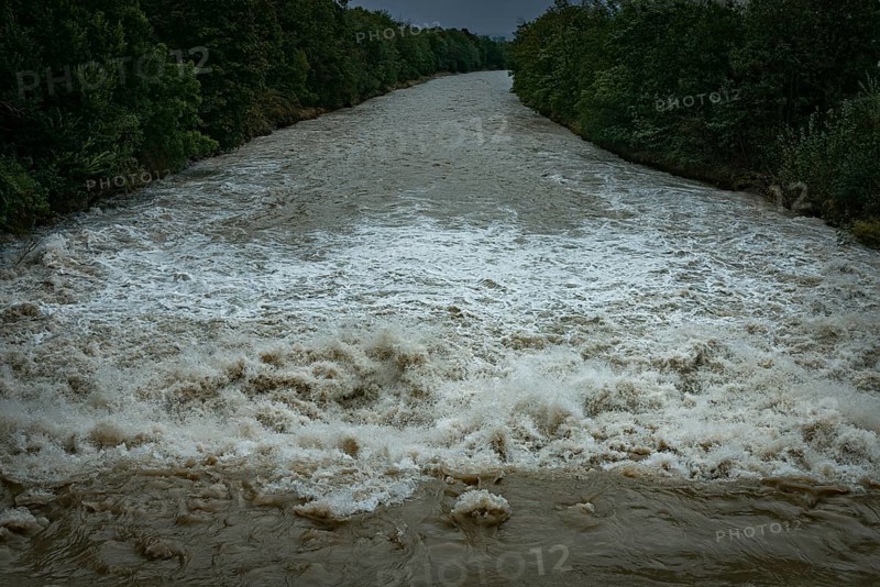 A powerful river with a strong current under a cloudy sky, surrounded by green trees, Schwarza, Neunkirchen, Lower Austria, Austria, Europe