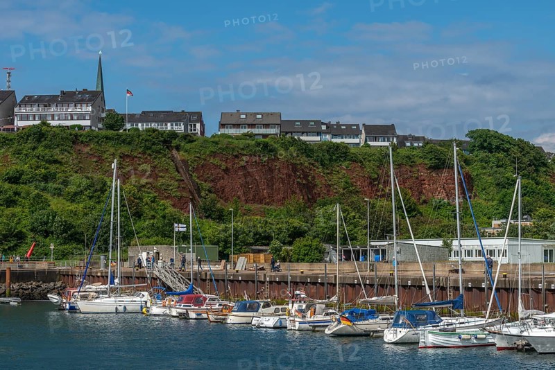Sailing yachts in the north-east harbour, Buntsandstein cliff, Helgoländer Oberland with church tower of the Nicolaikirche, offshore island Helgoland, North Sea, district Pinneberg, Helgoland, Schleswig-Holstein, Germany, Europe